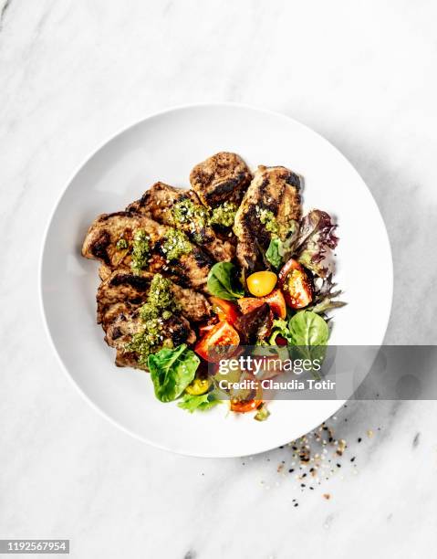 grilled pork cutlets with salad in a bowl on white background - barbecue pork stock pictures, royalty-free photos & images