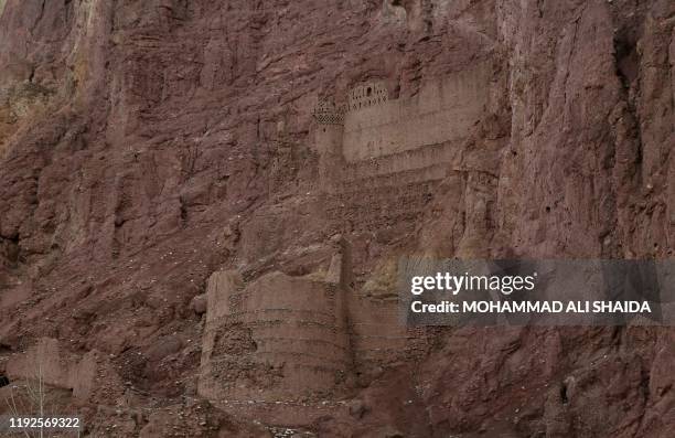 This photograph taken on November 18, 2019 shows remnants of the ancient settlement of Zuhak in a valley on the outskirts of Bamiyan. - After bearing...