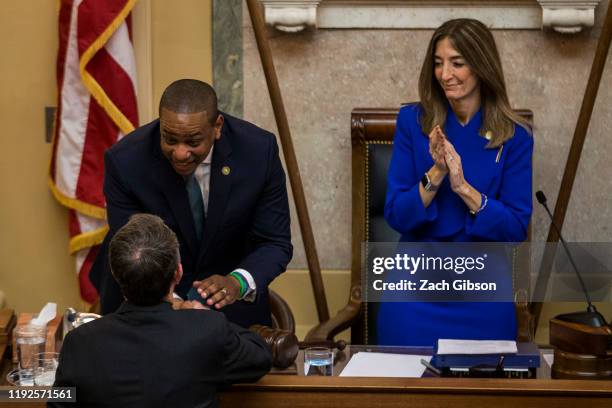 Lt. Gov. Justin Fairfax shakes hands with Gov. Ralph Northam as House of Delegates Speaker Eileen Filler-Corn looks on following the State of the...