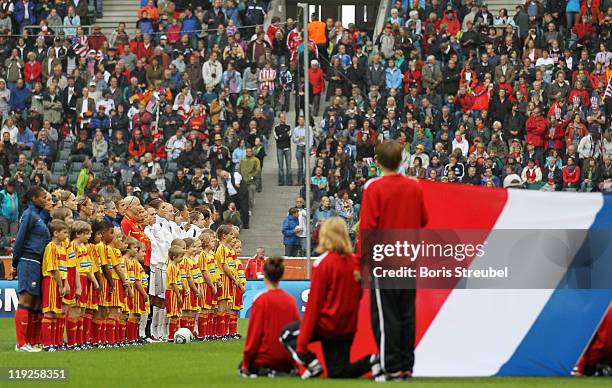 The teams of France and USA line up prior to the FIFA Women's World Cup 2011 Semi Final Match between France and USA at Stadion im Borussiapark on...