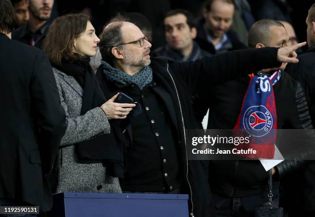 Denis Podalydes and his partner Leslie Menu attend the French League Cup quarter final between Paris Saint-Germain and AS Saint-Etienne at Parc des...