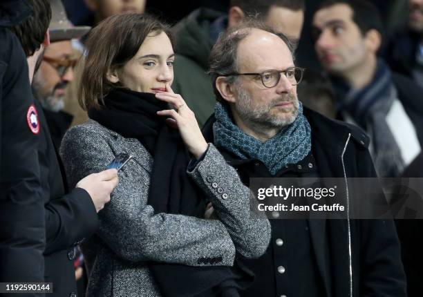 Denis Podalydes and his partner Leslie Menu attend the French League Cup quarter final between Paris Saint-Germain and AS Saint-Etienne at Parc des...