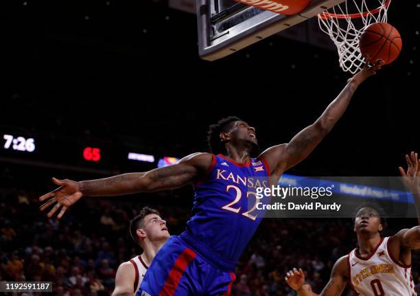 Silvio De Sousa of the Kansas Jayhawks lays up a shot as Michael Jacobson, and Zion Griffin of the Iowa State Cyclones defend in the second half of...