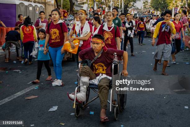 Filipino Catholic devotee on a wheelchair takes part in the annual procession of the Black Nazarene on January 9, 2020 in Manila, Philippines. The...