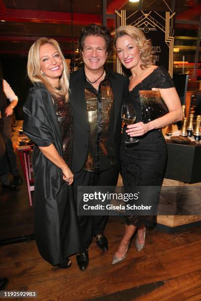 Francis Fulton Smith and his girlfriend Claudia Hillmeier and Monika Gruber during SaskiaGreipl's 50th birthday celebration at Feinkost Kaefer on...