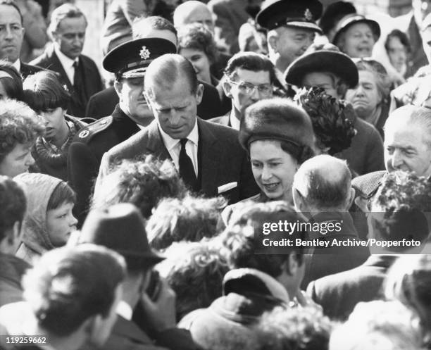 Queen Elizabeth II and Prince Philip visit the coalmining village of Aberfan in South Wales, eight days after the disaster in which 116 children and...