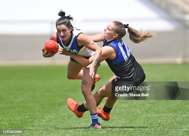 Jess Trend of the Kangaroos is tackled during a North Melbourne Kangaroos AFLW Match Simulation Training Session at North Hobart Oval on December 08,...