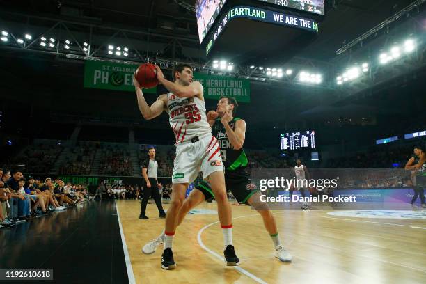 Clint Steindl of the Wildcats and Ben Madgen of the Phoenix contest the ball during the round 10 NBL match between the South East Melbourne Phoenix...