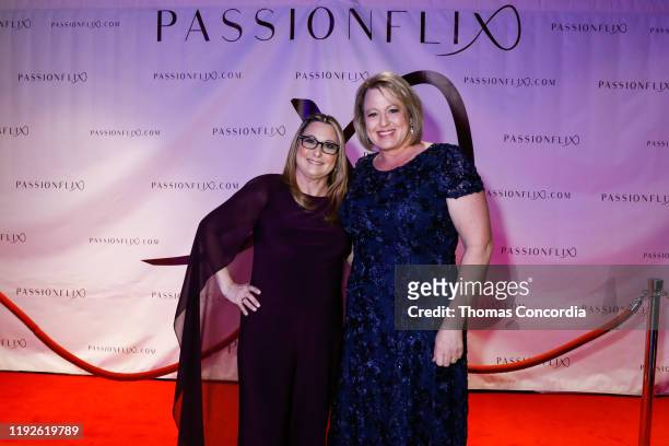 Authors, Carly Phillips and Erika Wilde attend the World Premiere Of Passionflix's "Dirty Sexy Saint" at Regal Essex Crossing on December 07, 2019 in...