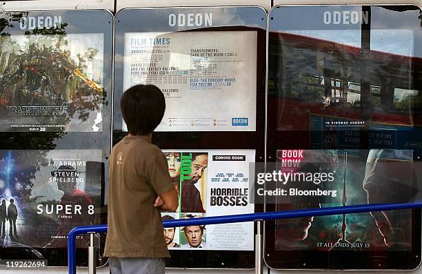 Cinema posters advertising future films sit on display outside the Odeon cinema on Leicester Square, in London, U.K., on Friday, July 15, 2011. BC...