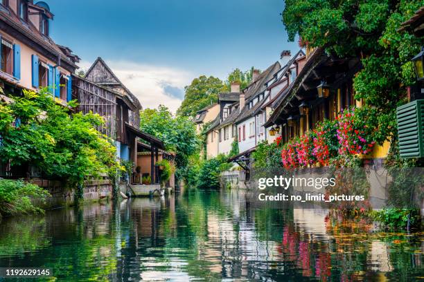canal through colmar in france - alsace stock pictures, royalty-free photos & images