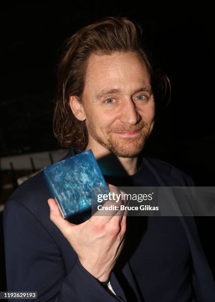 Tom Hiddleston poses with the "Tesseract Blue Infinity Stone" backstage at "Betrayal" on Broadway at The Jacobs Theatre on December 7, 2019 in New...