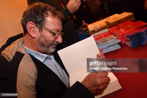 Signs autograph after the Scrittori a Teatro - LÕAMACA DI DOMANI on November 16, 2019 in Cuneo, Italy.