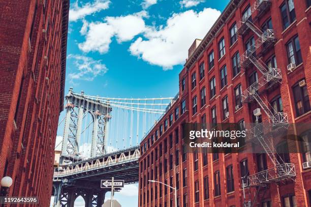 manhattan bridge as seen from dumbo brooklyn - brooklyn heights stock pictures, royalty-free photos & images