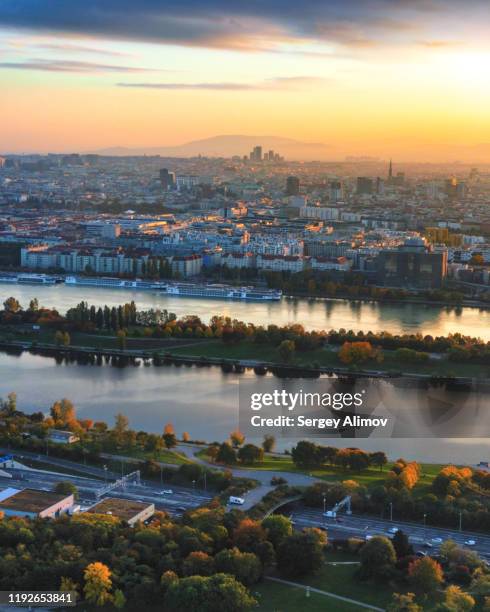 romantic sunset over vienna and danube river - vertikal stock-fotos und bilder