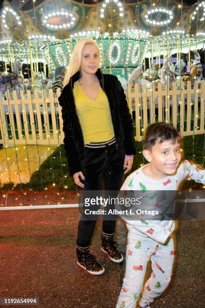 Kristi Tucker and Brody Dev attend Media And VIP Night Queen Mary Christmas held at The Queen Mary on December 6, 2019 in Long Beach, California.
