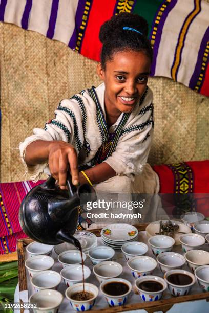 young african girl preparing coffee, ethiopia. east africa - ethiopian coffee ceremony imagens e fotografias de stock