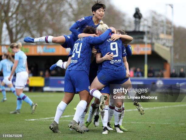 Maren Mjelde of Chelsea celebrates with team mates after scoring her sides second goal during the Barclays FA Women's Super League match between...