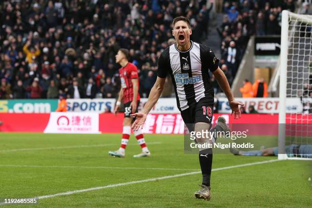 Federico Fernandez of Newcastle United celebrates after scoring his team's second goal during the Premier League match between Newcastle United and...