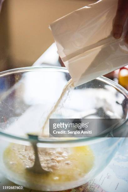 pouring pancake mix in a glass bowl - mixing stock pictures, royalty-free photos & images