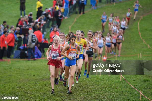 Anna Emilie Moller of Denmark and Jasmijn Lau of the Netherlands compete during the U23 Women final race of the SPAR European Cross Country...