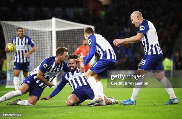 Davy Propper of Brighton and Hove Albion celebrates with teammates after scoring his team's second goal during the Premier League match between...