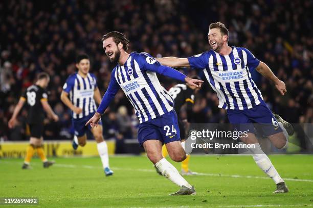 Davy Propper of Brighton and Hove Albion celebrates with teammate Dale Stephens after scoring his team's second goal during the Premier League match...