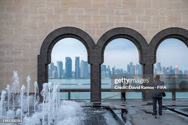 Visitors enjoy the views over the skyline of Doha from the Museum of Islamic Art on December 08, 2019 in Doha, Qatar.