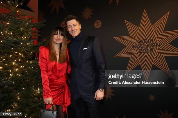 Robert Lewandowski of FC Bayern Muenchen attends with his wife Anna Lewandowska the clubs Christmas party at Allianz Arena on December 08, 2019 in...