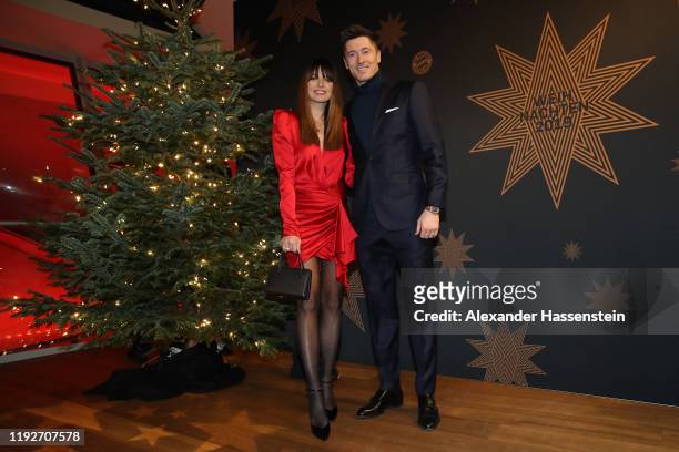 Robert Lewandowski of FC Bayern Muenchen attends with his wife Anna Lewandowska the clubs Christmas party at Allianz Arena on December 08, 2019 in...