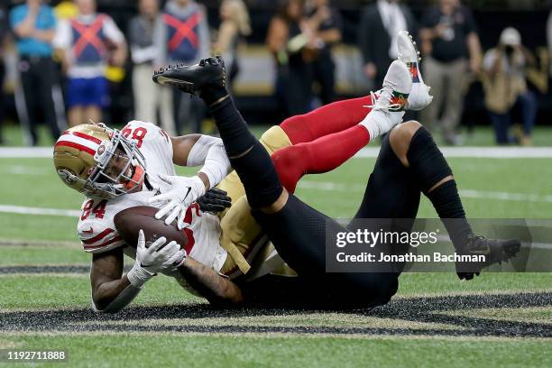 Kendrick Bourne of the San Francisco 49ers scores a 6 yard touchdown against Marshon Lattimore of the New Orleans Saints during the first quarter in...