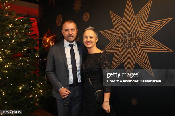 Hans-Dieter Flick, head coach of FC Bayern Muenchen attends with his wife Silke Flick the clubs Christmas party at Allianz Arena on December 08, 2019...