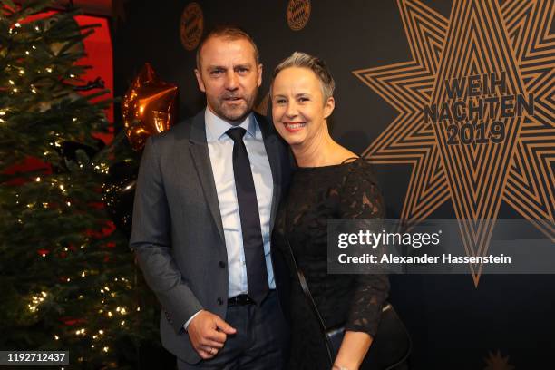 Hans-Dieter Flick, head coach of FC Bayern Muenchen attends with his wife Silke Flick the clubs Christmas party at Allianz Arena on December 08, 2019...