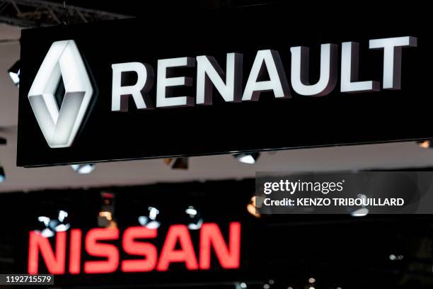 Renault and Nissan automobile logos are pictured during the Brussels Motor Show on January 9, 2020 in Brussels.