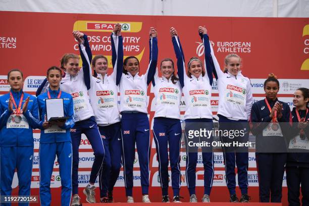 Gold Medalist Team of Great Britain reacts during the medal ceremony on the podium after finishing in the U23 Women Team at the SPAR European Cross...