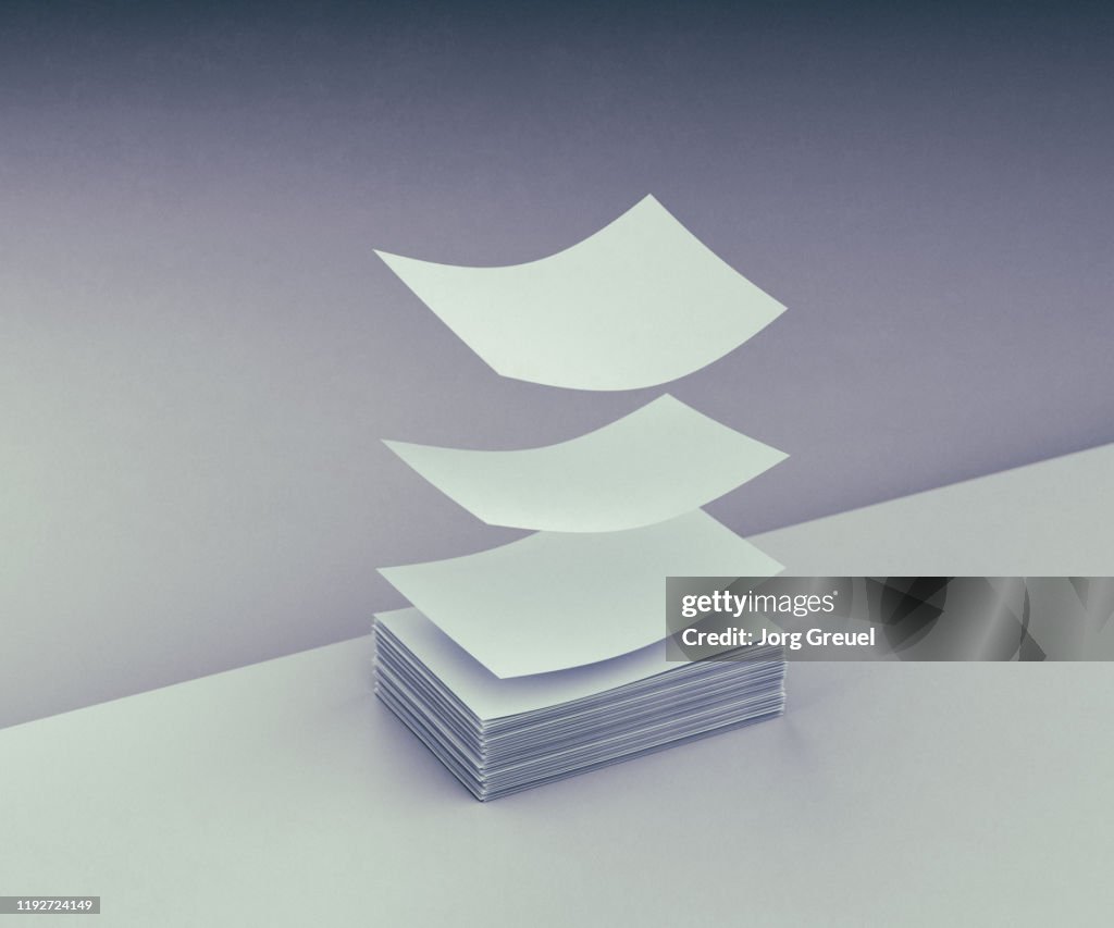 Paper Getting Up Sheets Of Paper Taking Off From Stack High-Res Stock Photo - Getty Images