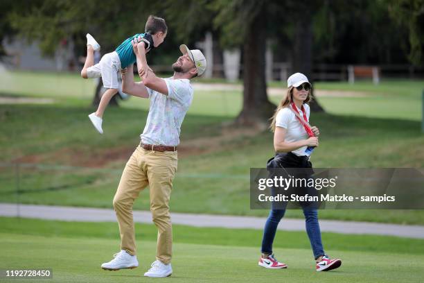 Justin Timberlake lifts up his son Silas next to his wife Jessica Biel ahead of the Pro-Am prior to the start of the Omega European Masters at at...