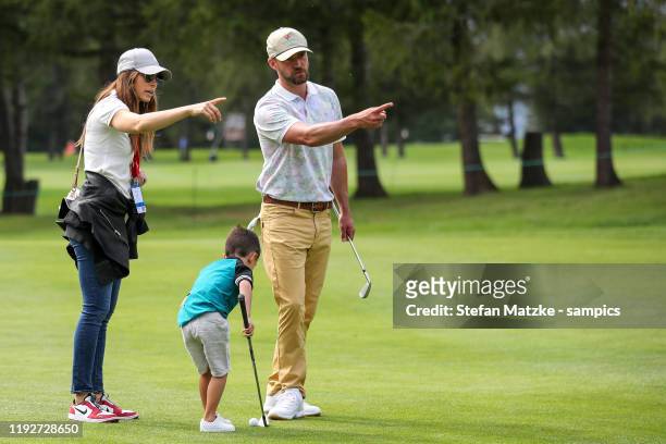 Justin Timberlake and his wife Jessica Biel talk to their son Silas ahead of the Pro-Am prior to the start of the Omega European Masters at at Crans...
