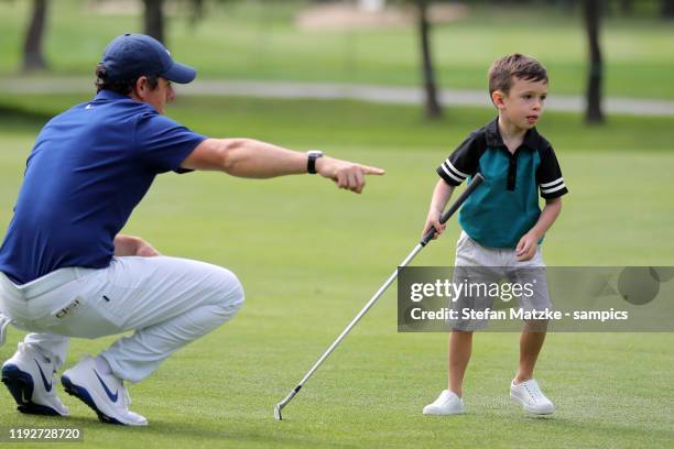 Rory McIlroy of Northern Ireland talks to Silas, son of musician Justin Timberlake and his wife Jessica Biel , ahead of the Pro-Am prior to the start...