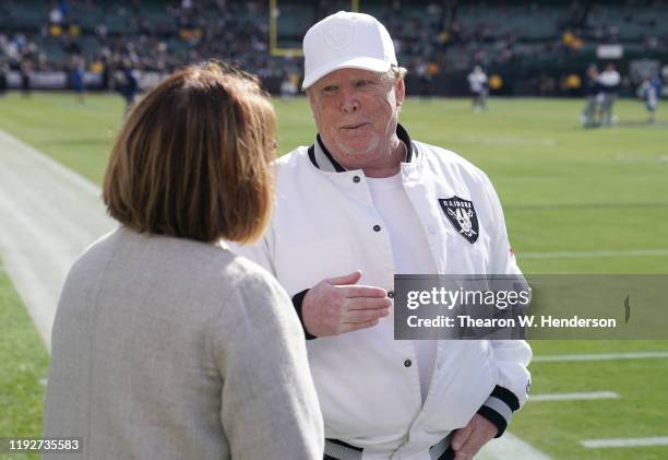 Oakland Raiders owner Mark Davis talks with the Tennessee Titans owner Amy Adams Strunk prior to the start of an NFL football game at RingCentral...