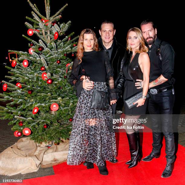 Sascha Vollmer with his wife Jenny Kurr and Alec Voelkel with his wife Johanna Voelkel during the Daimlers "BE A MOVER" event at Ein Herz Fuer Kinder...