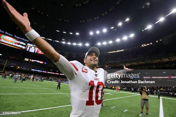 Jimmy Garoppolo of the San Francisco 49ers celebrates a win over the New Orleans Saints after a game at the Mercedes Benz Superdome on December 08,...