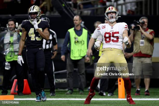 George Kittle of the San Francisco 49ers celebrates a touchdown against the New Orleans Saints during the third quarter in the game at Mercedes Benz...