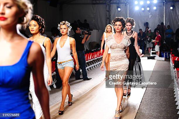 Models walk the runway prior to the Beach Bunny Swimwear show during Mercedes-Benz Fashion Week Swim on July 15, 2011 in Miami Beach, Florida.