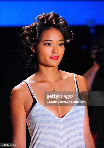 Model walks the runway prior to the Beach Bunny Swimwear show during Mercedes-Benz Fashion Week Swim on July 15, 2011 in Miami Beach, Florida.