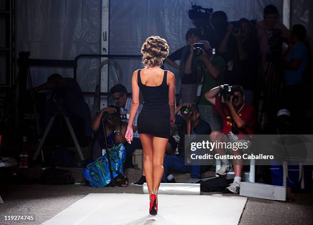 Model walks the runway prior to the Beach Bunny Swimwear show during Mercedes-Benz Fashion Week Swim on July 15, 2011 in Miami Beach, Florida.