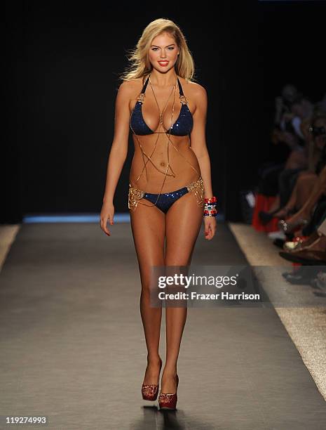 Kate Upton walks the runway at the Beach Bunny Swimwear show during Mercedes-Benz Fashion Week Swim at The Raleigh on July 15, 2011 in Miami Beach,...