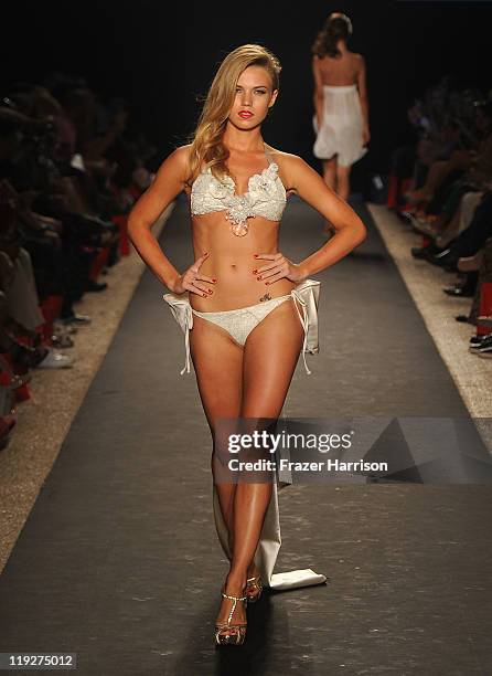 Model walks the runway at the Beach Bunny Swimwear show during Mercedes-Benz Fashion Week Swim at The Raleigh on July 15, 2011 in Miami Beach,...