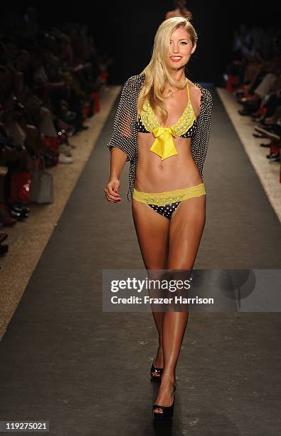 Model walks the runway at the Beach Bunny Swimwear show during Mercedes-Benz Fashion Week Swim at The Raleigh on July 15, 2011 in Miami Beach,...