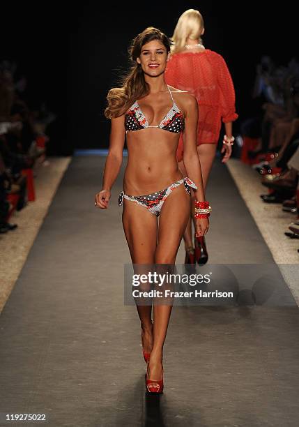 Model walks the runway at the Beach Bunny Swimwear show during Mercedes-Benz Fashion Week Swim at The Raleigh on July 15, 2011 in Miami Beach,...